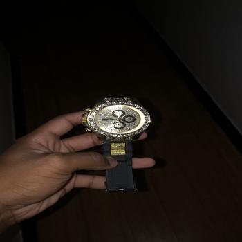 gold and black men watch
